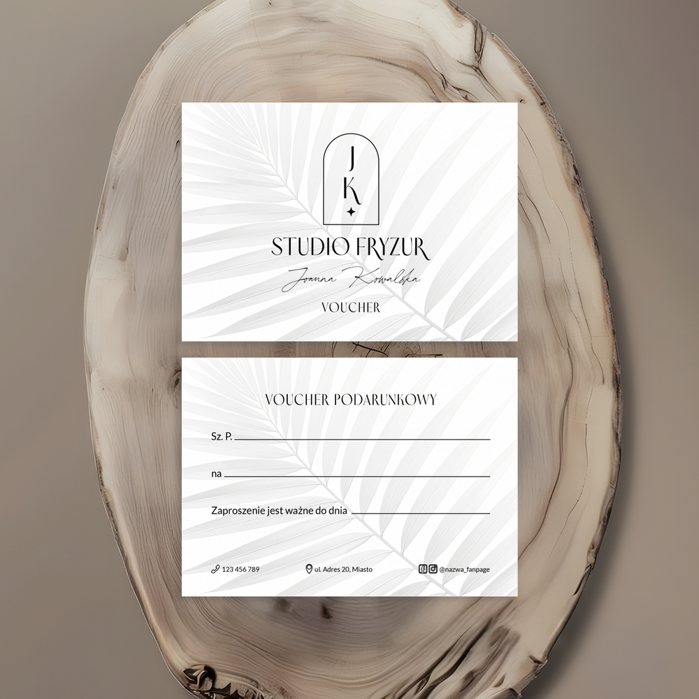bony prezentowe z logo salonu fryzjerskiego na tle liścia